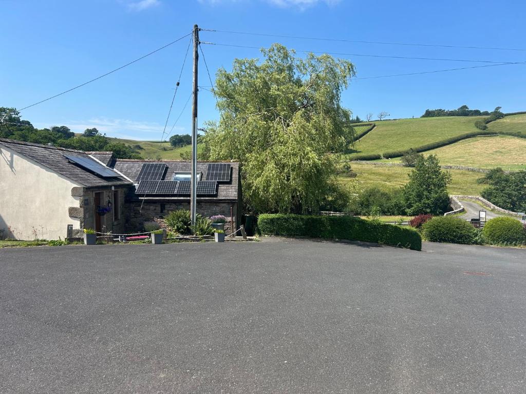 a house with a driveway in front of a house at Swaledale Watch Garden Annexe in Wigton