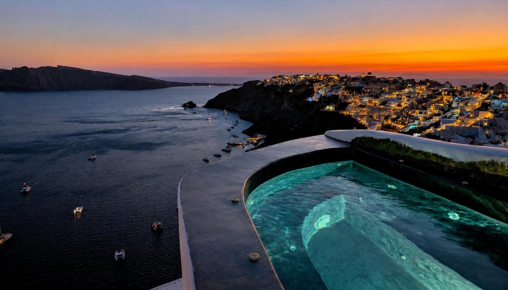 an outdoor swimming pool with a view of the ocean at Captain John Oia Cave Houses-Sunset,Volcano & Caldera Views in Oia
