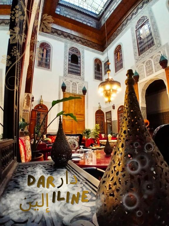 a room with two vases sitting on a table at Dar Iline - RoofTop in Fez