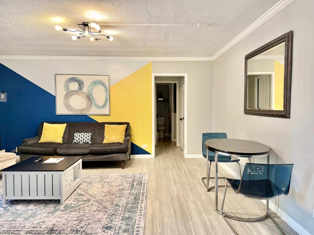 a living room with a couch and a table at Downtown Condo! Private Balcony! PT10F in Atlanta