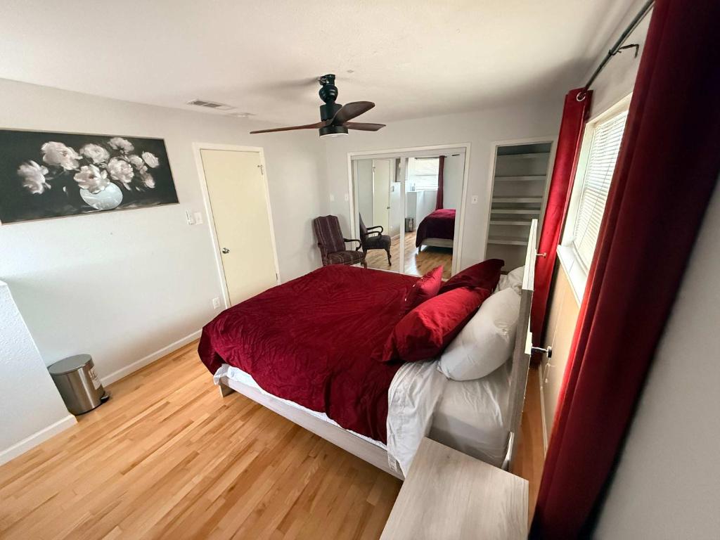 a bedroom with a bed and a ceiling fan at The Loft in McKinney