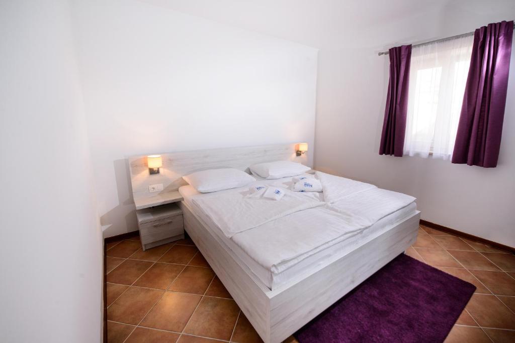 Postel nebo postele na pokoji v ubytování Plavo nebo Istra Apartments