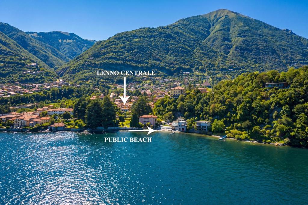 an aerial view of a lake with mountains in the background at Lenno Centrale in Lenno