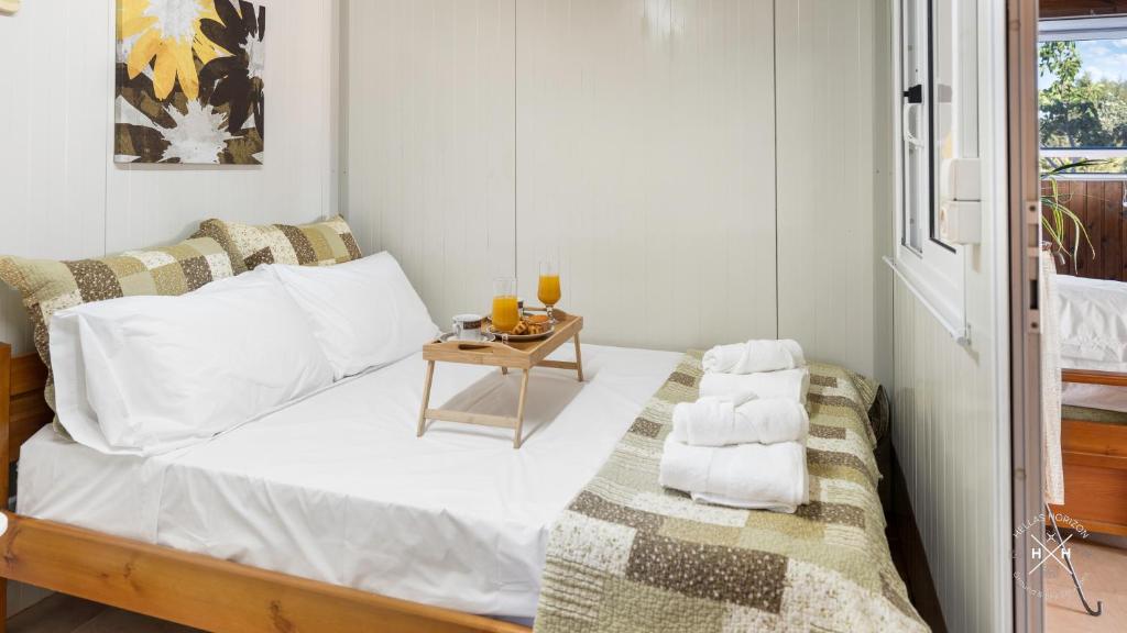 a bedroom with a bed with a side table at Casa fig Crete in Chania