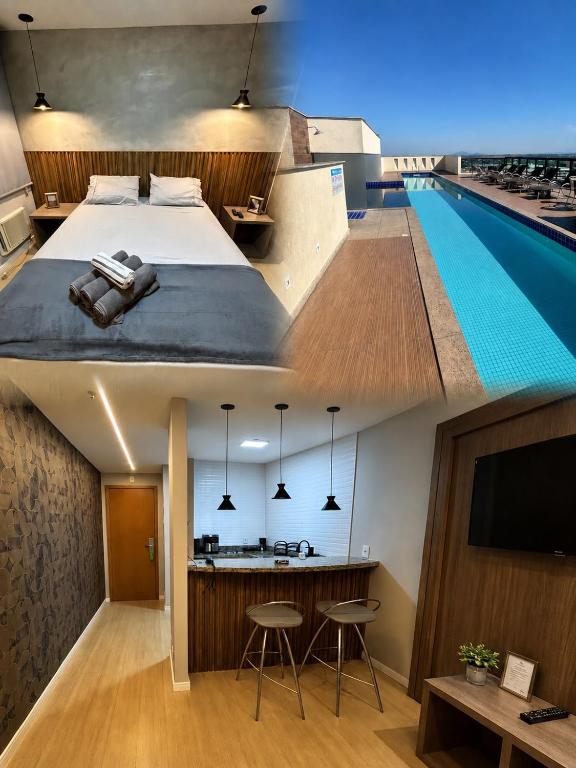 a hotel room with a bed and a swimming pool at Flat Completo no Centro de Itaboraí Promenade Prime in Itaboraí