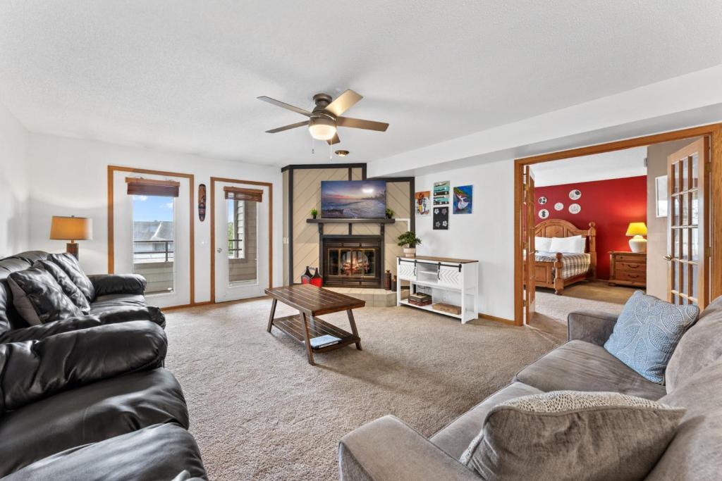 a living room with a couch and a table at Dells Family Stacation in Wisconsin Dells