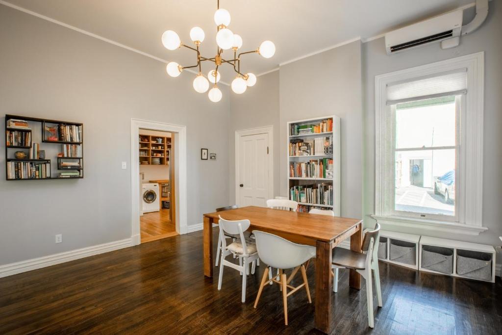 a dining room with a wooden table and chairs at Kid-Friendly Stay with Backyard: Long Stays in Salt Lake City
