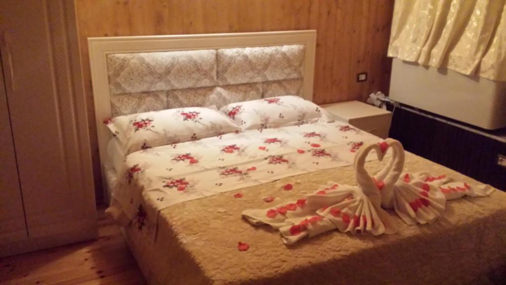 Postel nebo postele na pokoji v ubytování Hotel Vataksi