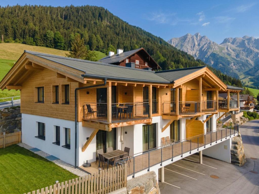 an aerial view of a house with mountains in the background at Hochkönigblick I in Werfenweng