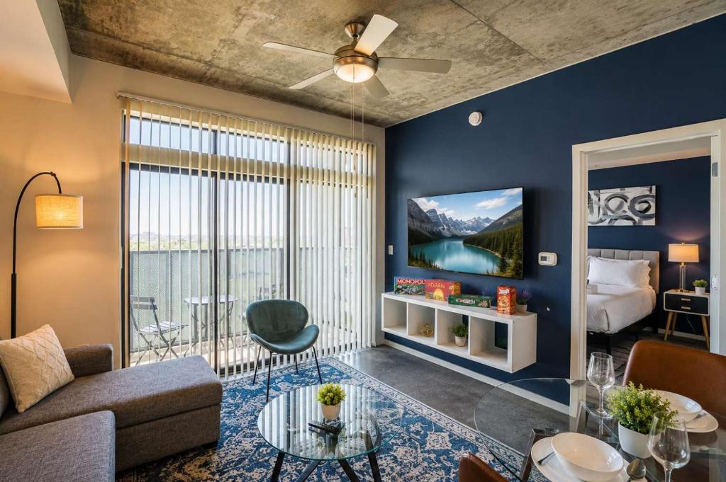 a living room with a couch and a bed at Spacious 2BR Apt with Gym Pool Parking in Phoenix