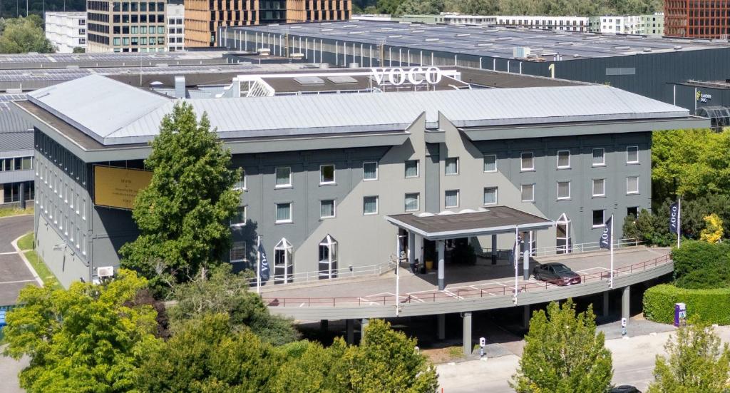 an aerial view of a building in a city at voco Gent by IHG in Ghent