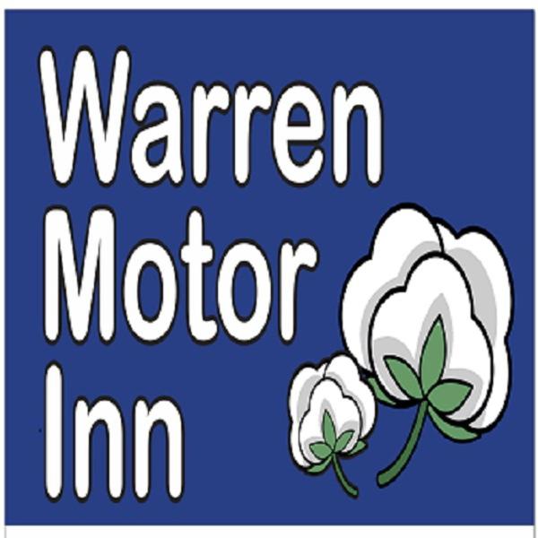 a sign with a flower and the words winter motor inn at Warren Motor Inn in Warren