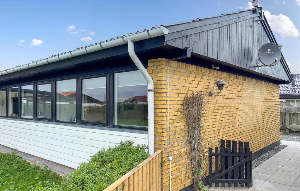 a building with a bunch of windows on it at Awesome Home In Thyborøn With Wifi in Thyborøn