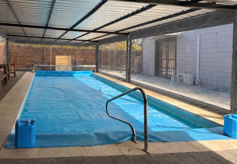 a large swimming pool in a building at Descanso Cuchilla Alta in Cuchilla Alta
