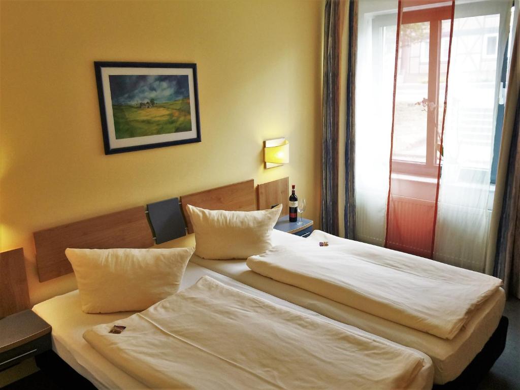 Postel nebo postele na pokoji v ubytování Hotel Ambiente