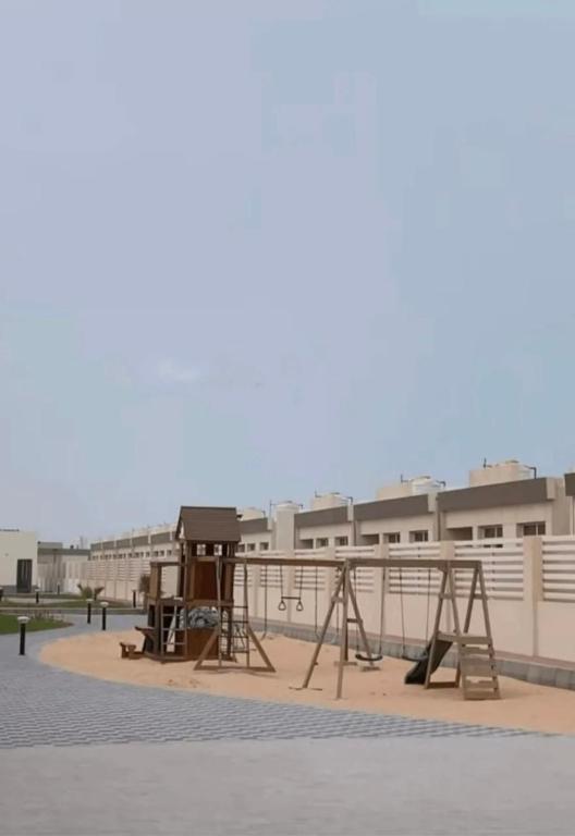 a playground in front of a building at AlSeef 161 in Al Sharqiyah