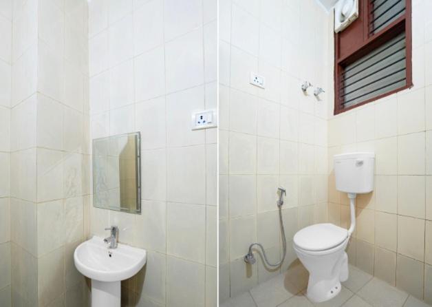 a bathroom with a toilet and a sink at Shivik stays in Gurgaon