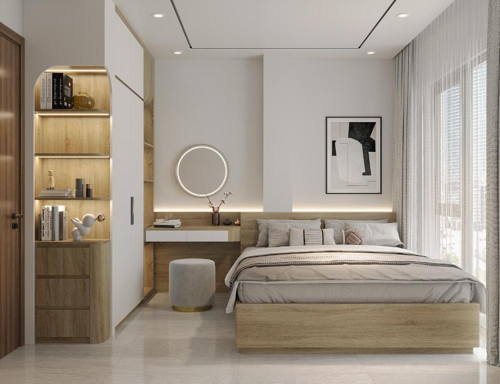 a bedroom with a large bed and a mirror at Westlake House By Jen in Hanoi