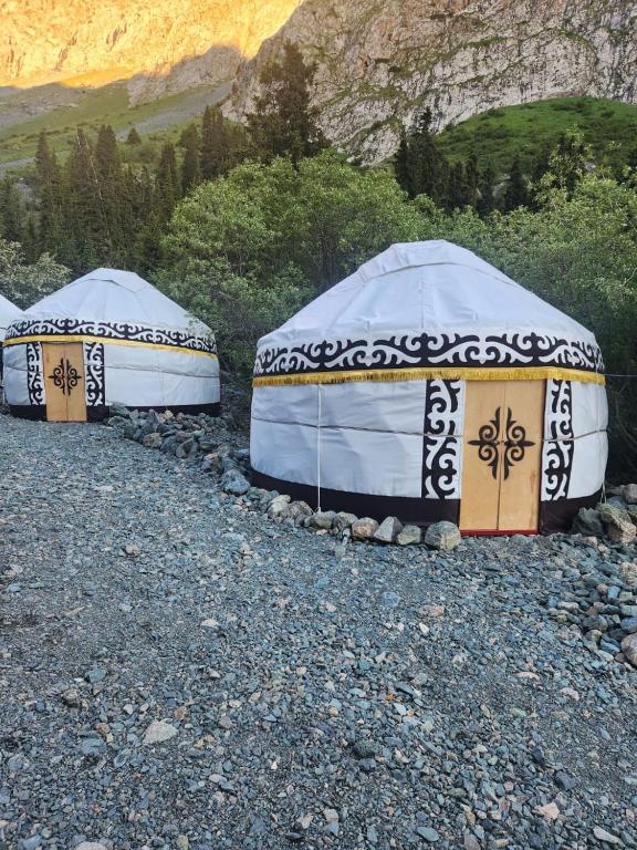 a couple of tents sitting on top of a mountain at Kerben yurt camp in Mineralʼnyy Istochnik Altyn-Arasan