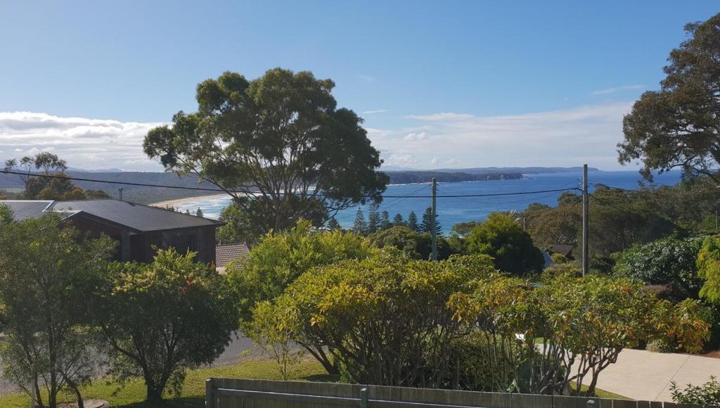 a view of the ocean from a house at Beach Break in Tathra