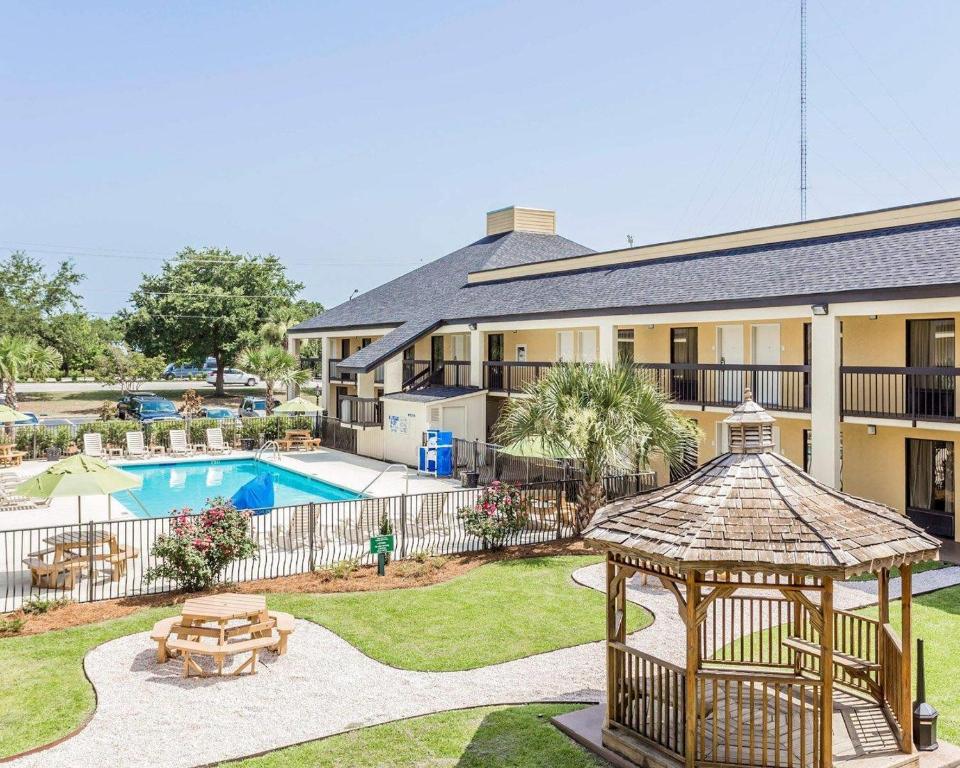 a house with a gazebo and a swimming pool at Quality Inn Mt Pleasant - Charleston in Charleston