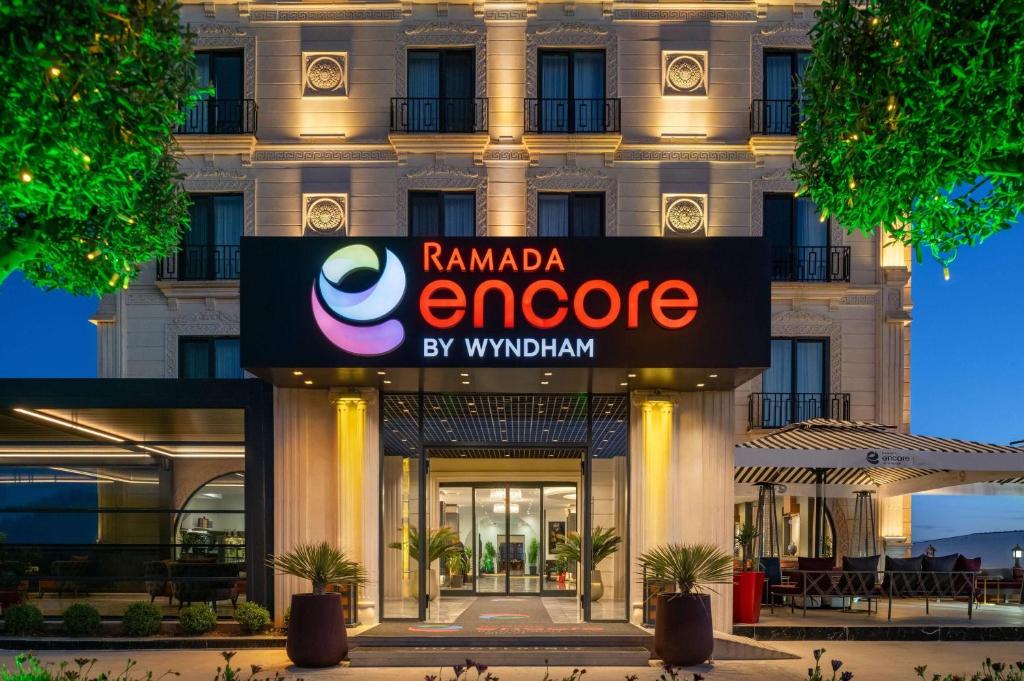 a rendering of the entrance to the emerson hotel at Ramada Encore by Wyndham Midyat in Midyat