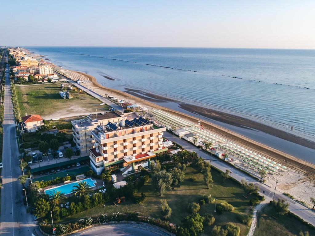 an aerial view of a resort and the beach at UNA HOTELS Imperial Beach Hotel in Marotta