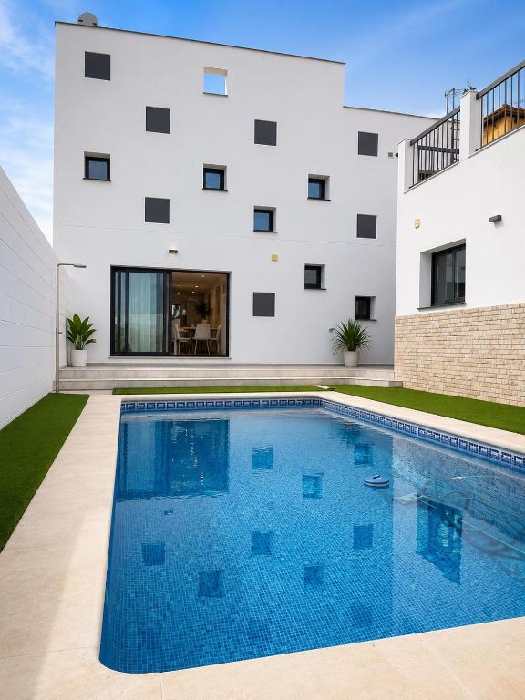 a swimming pool in front of a building at Pozo, 22 in Fuente Palmera