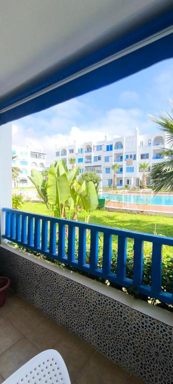 a balcony with a view of a large building at kabila vista vuestra a la piscina Z6 in Martil