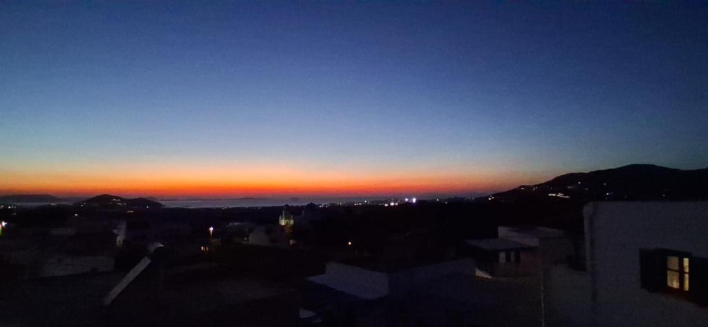 a view of the sunset from a city at night at Naxian Scenery in Glinado Naxos