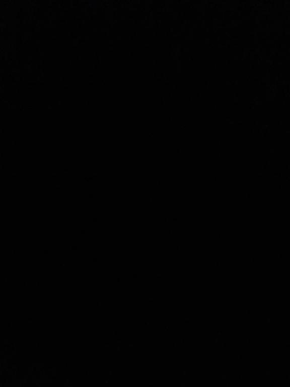 a dark room with a clock on the wall at Rum lmea in Disah