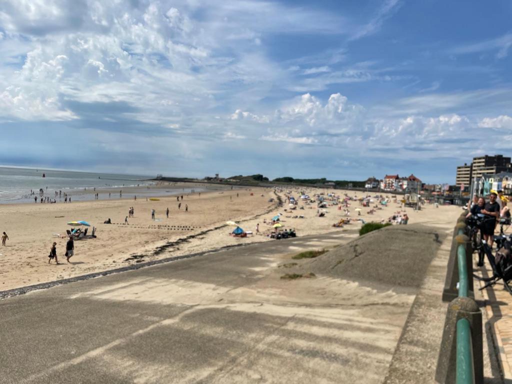 a beach with a lot of people on it at SB villa house in Vlissingen
