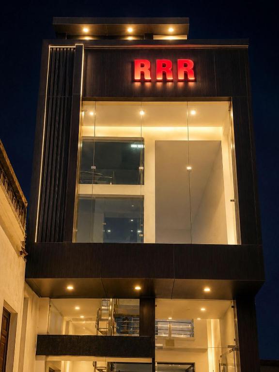 a building with a red neon sign on it at ramraz residency in Ayodhya