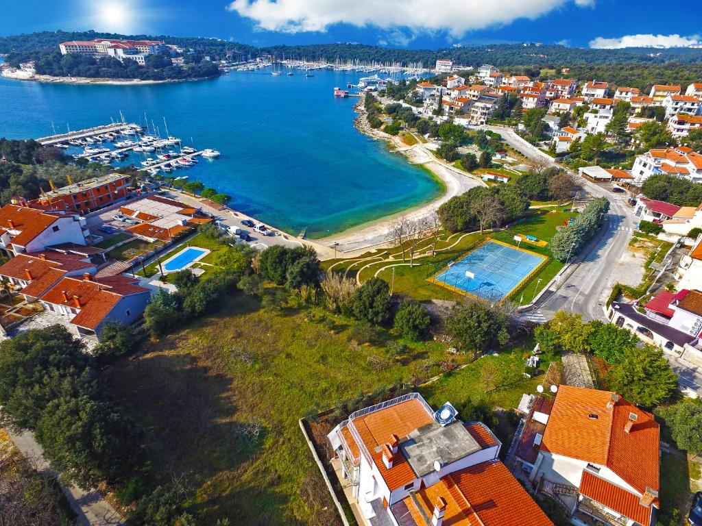 an aerial view of a city and a harbor at Apartments by the Sea 750 in Pješčana Uvala 
