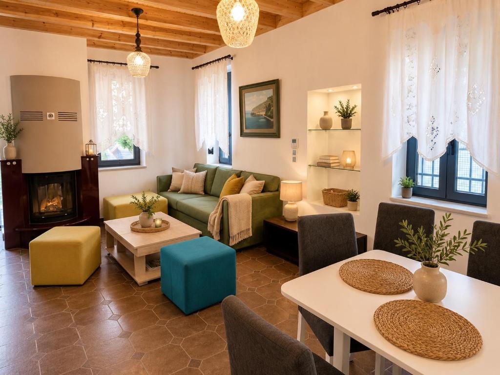 a living room with a couch and a table at Aeolian Garden in Mytilene