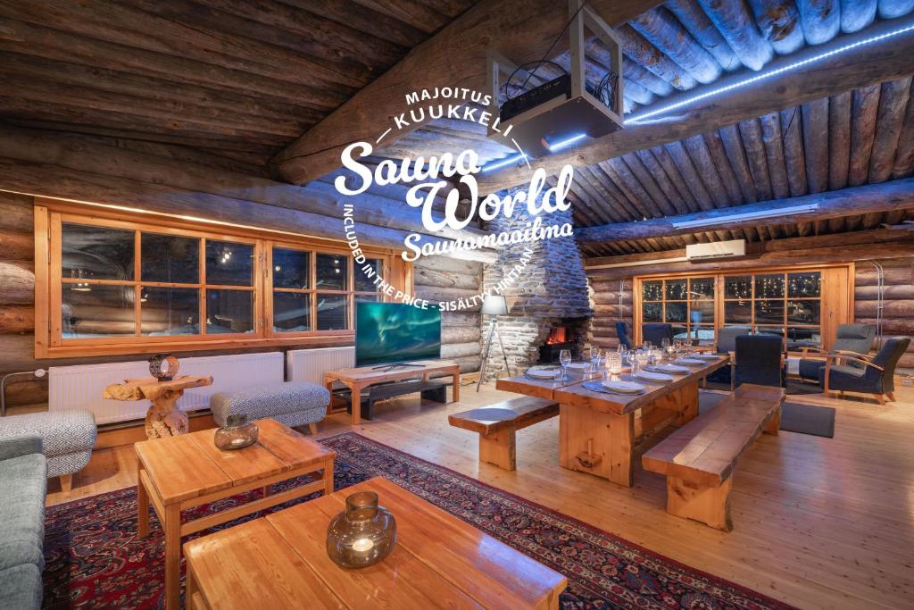 a living room with tables and a sign that reads southern world at Kuukkeli Log Houses Aurora Resort in Saariselka