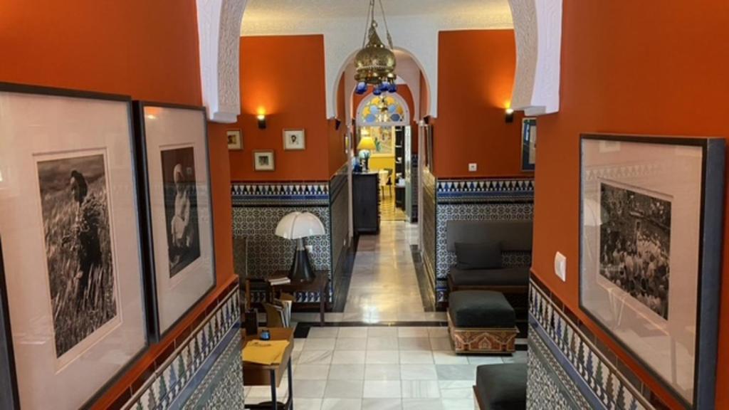 a hallway in a building with orange walls at villazancot in Tangier
