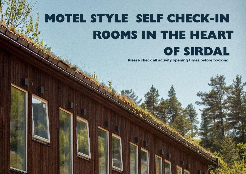 a sign for a hotel style self check in rooms in the heart of studeland at Sirdal fjellpark in Tjørhom