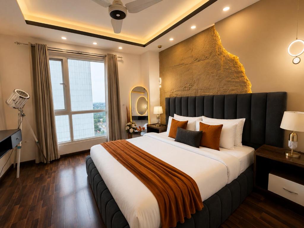 a bedroom with a large bed and a large window at 1BR Luxury Apartments With Balcony & Mountains View In Elysium Tower OPP Centaurus Mall Islamabad in Islamabad