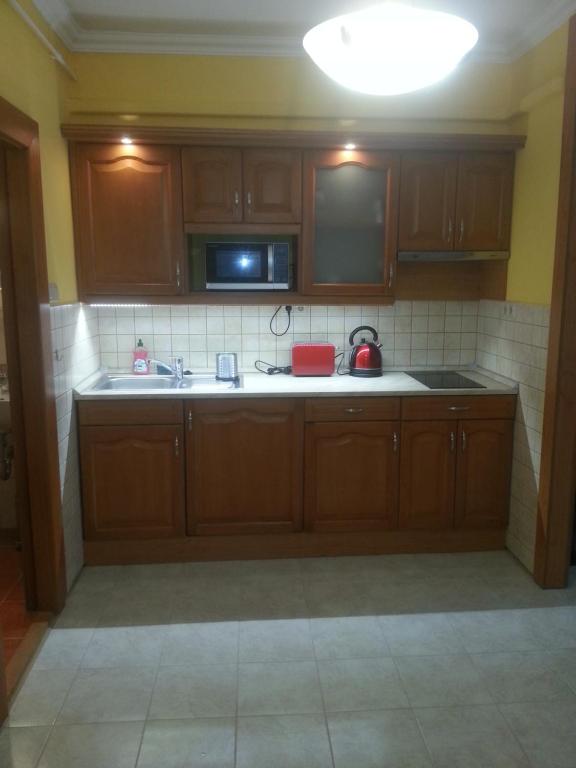Kuchyňa alebo kuchynka v ubytovaní Szinva Apartman Miskolc