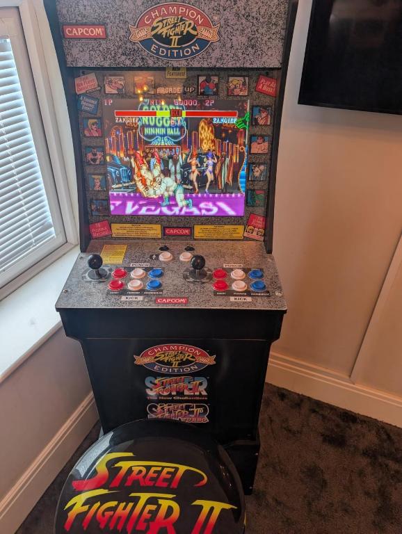 a video game machine with a pinball at Withnell Stays - Apartment Three - Retro Gaming in Blackpool