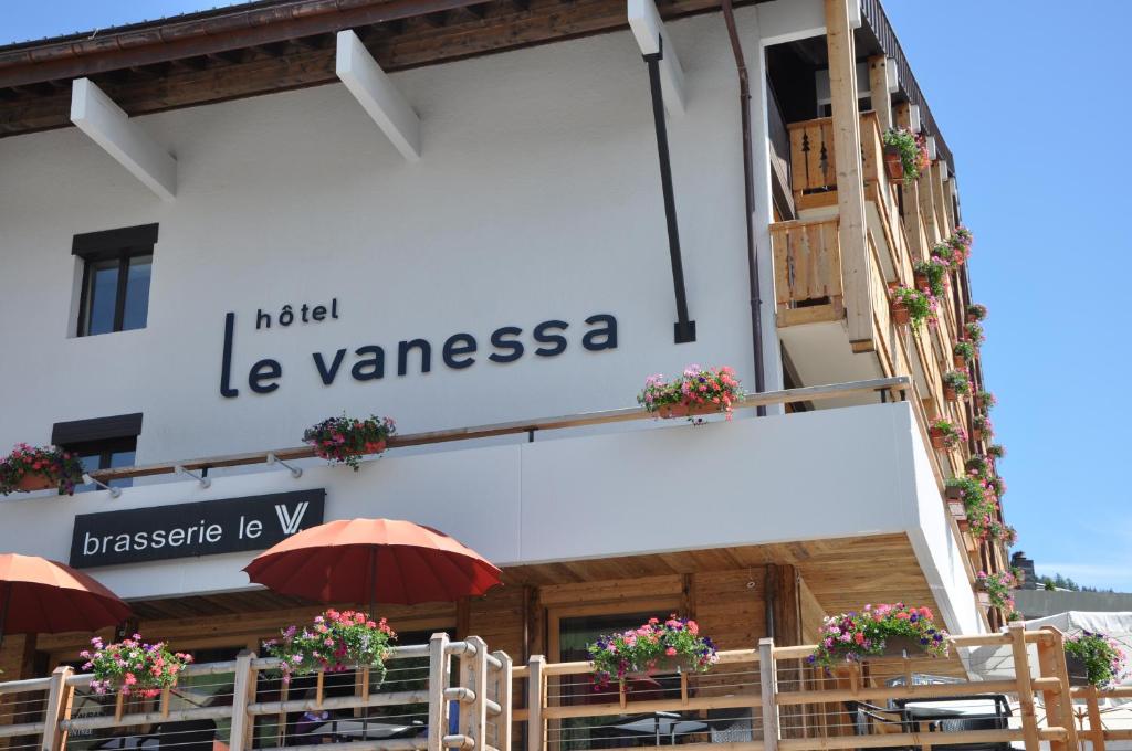 a building with a sign that reads hotel la vyssosa at Hôtel Vanessa in Verbier