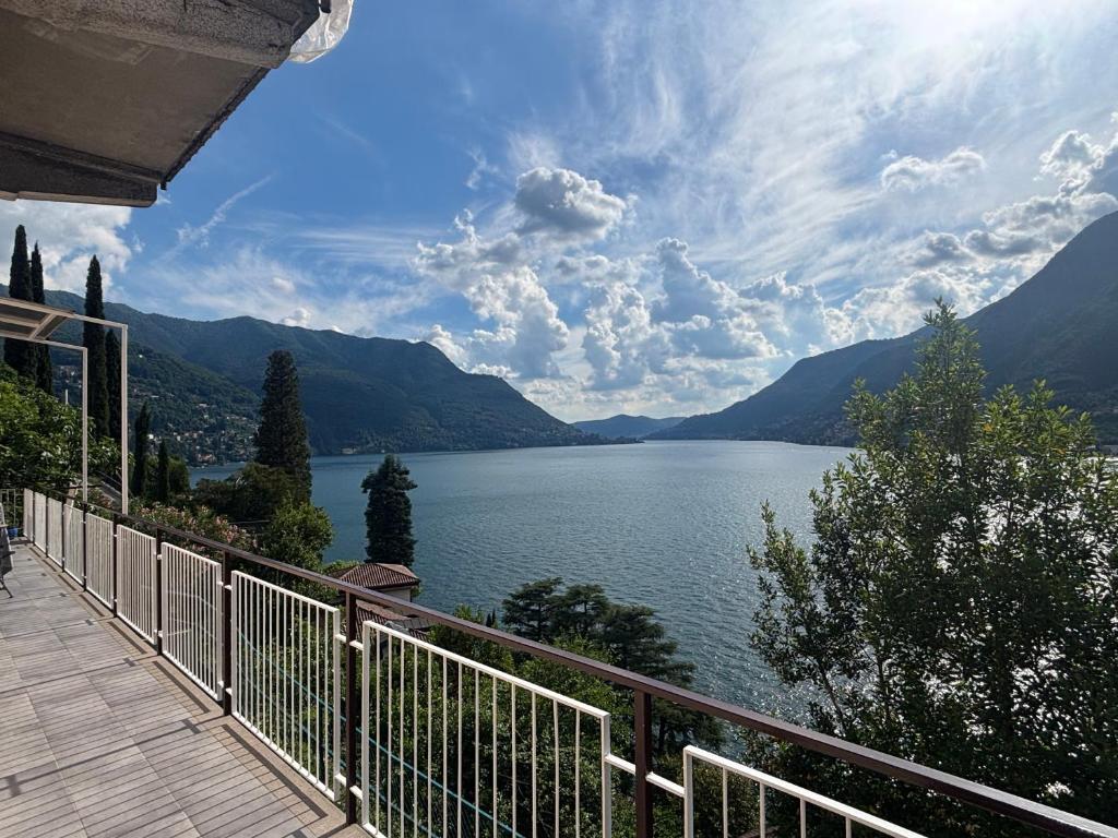 a view of a lake from a balcony of a house at Como Lake Paradise vicino a Nesso e Bellagio in Pognana Lario