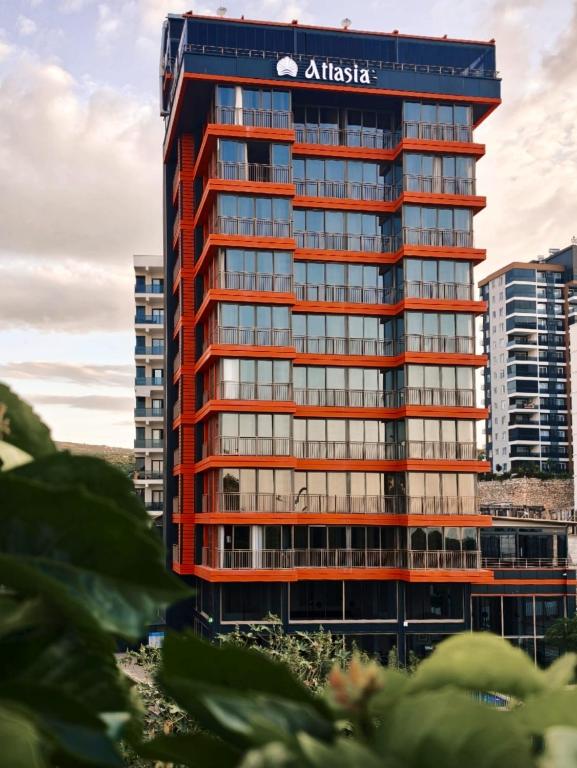 a tall building with anadobeadobe sign on it at Atlasia Suit in Erdemli