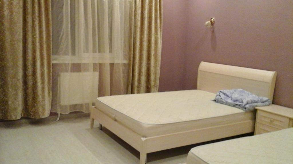 
Кровать или кровати в номере Apartment on Vokzalnaya 55
