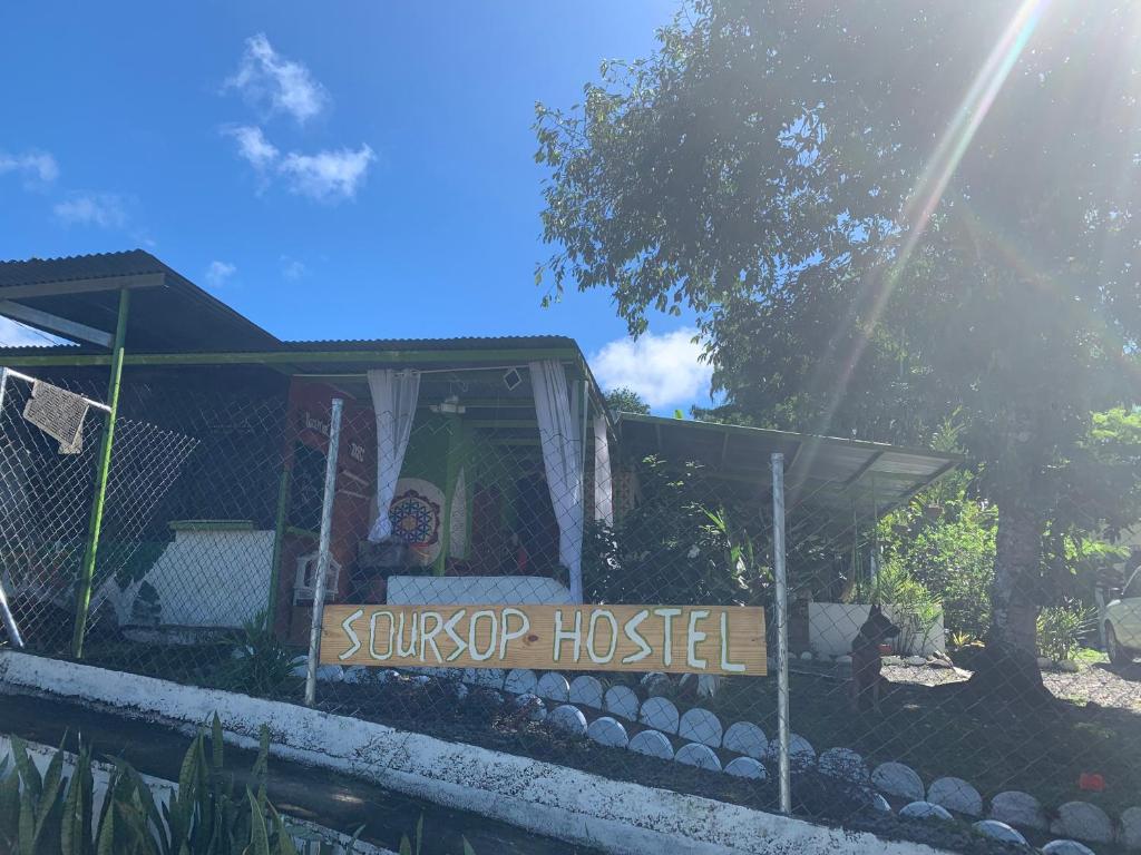 a toy house with a sign that reads sunoco hospital at Soursop Hostel in Cueta