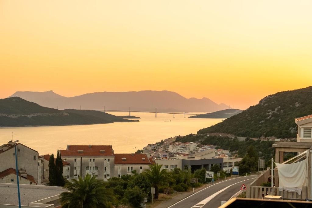 a city with a view of the water and a bridge at Casa sul Mare Luxury Sea View Apartments in Neum