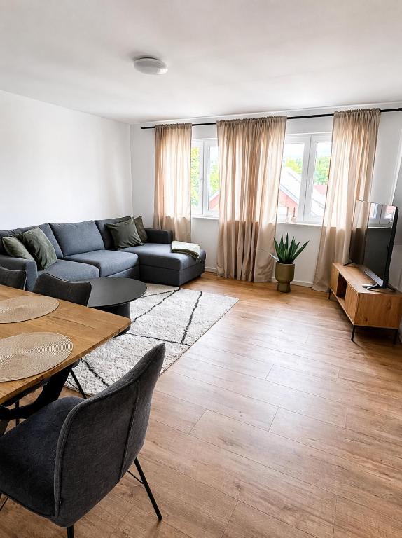a living room with a couch and a table at Apartment -Wohnung Herford in Herford