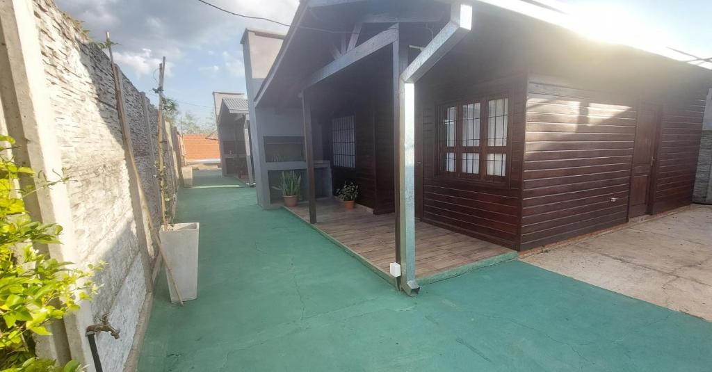 an external view of a house with a patio at JuanSe Cabaña in Ituzaingó