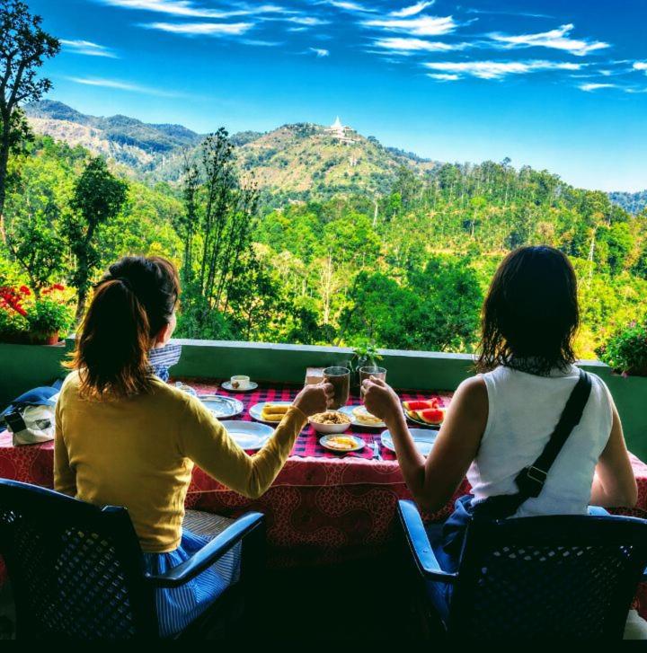 two women sitting at a table with a view at Hushwood ELLA in Ella